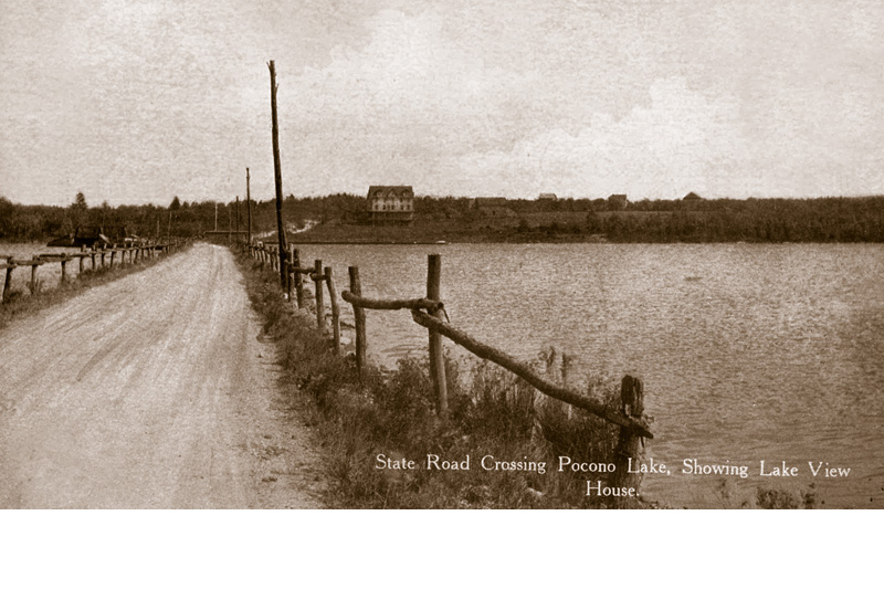 State Route 940 as it crosses Pocono Lake, facing east. The Lake View House can be seen on the eastern shore. The ice house was a few hundred yards further south (right), out of view.