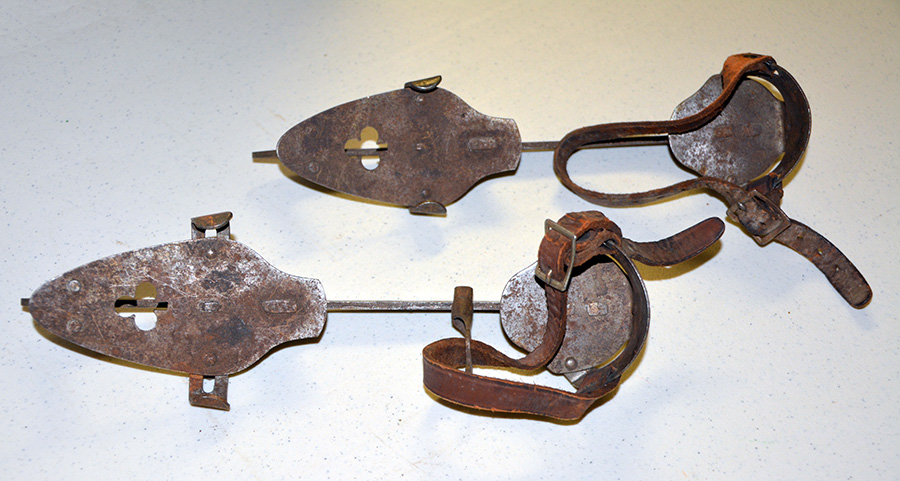 Adjustable ice skates that were clamped and buckled onto shoes