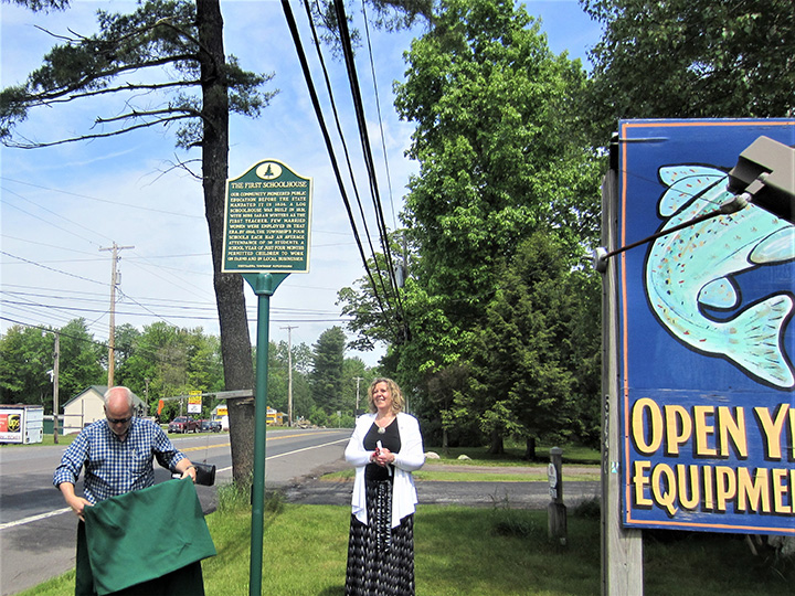 The First Schoolhouse historical marker is revealed for the first time.
