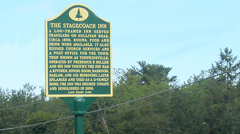 The historical marker for The Stagecoach Inn, sponsored by the Lake Naomi Club.